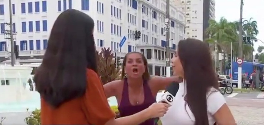 Mulher surge em transmissão ao vivo e grita “Globo lixo”